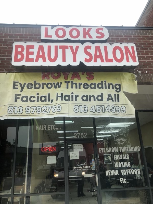 Looks Beauty Salon sign: Roya's Eyebrow Threading, Facial, Hair and All