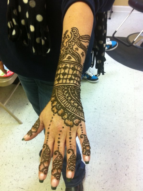 Intricate henna design on the hand